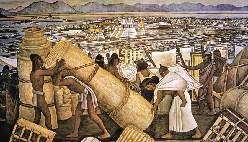 Aztekowie transportują wielkie zwoje mat i tkanin na tle tętniącego życiem miasta Tenochtitlan.